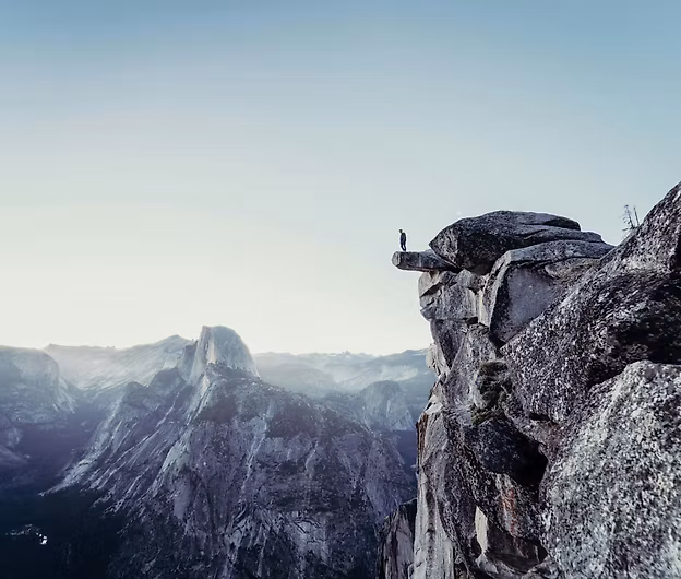 a climber on top of a montain